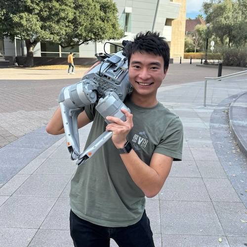 Maximilian Du with a robot dog